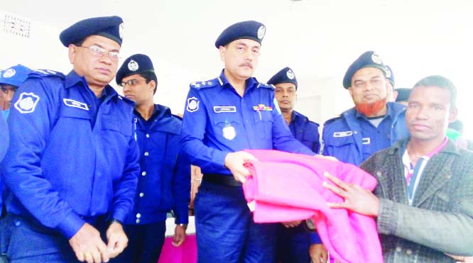 GANGACHARA (Rangpur): Devdas Bhattacharya , Deputy Inspector General of Police (DIG) of Rangpur Range distributing blankets among the cold- hit people at Gangachara Upazila on Thursday.