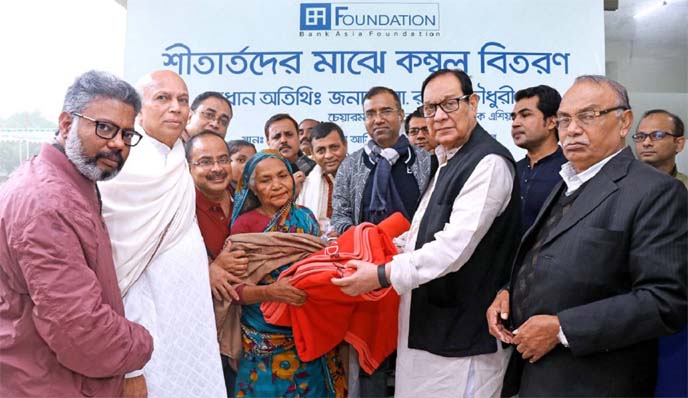 A. Rouf Chowdhury, Chairman of Bank Asia Limited, distributing blankets among cold affected people at the premise of Bank Asia-Maa Amiran Hospital, Malkhanagar, Munshiganj recently. Aminul Islam, Executive Director of Bank Asia Foundation and S M Anisuzza