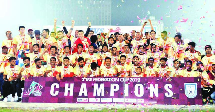 Members of Bashundhara Kings, the champions in the TVS Federation Cup Football pose for a photo session at the Bangabandhu National Stadium on Sunday.