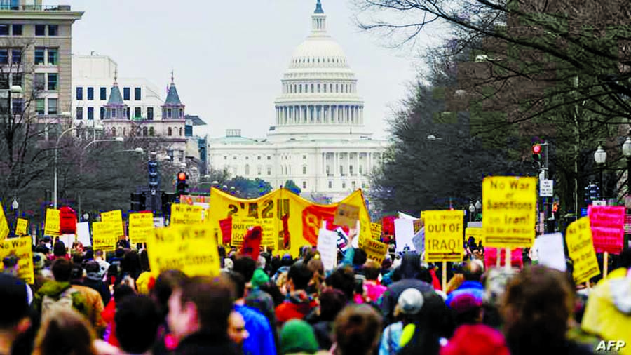 Anti-war activists march from the White House to the Trump International Hotel in Washington, DC. Internet photo