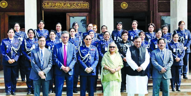 Prime Minister Sheikh Hasina poses for a photo session with female police officials after exchanging views with high police officials at her office on Monday marking Police Week-2020. BSS photo