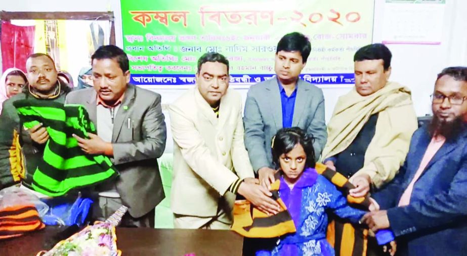 PANCHBIBI (Joypurhat): Nayeem Sarwar , UNO, Panchbibi Upazila distributing blankets among the disabled students at the Municipality areas on Monday.