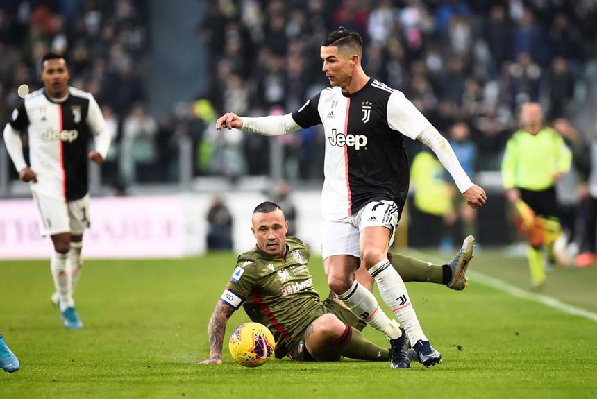 Juventus' Cristiano Ronaldo (right) leaves Cagliari's Radja Nainggolan trailing in his wake during their Serie A match in Turin on Monday.