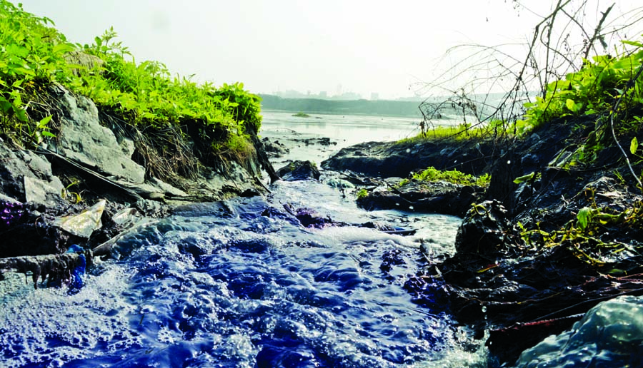 Water mixed with industrial chemical drains into Balu River polluting the river water. The picture was taken from Demra area in Dhaka on Tuesday.