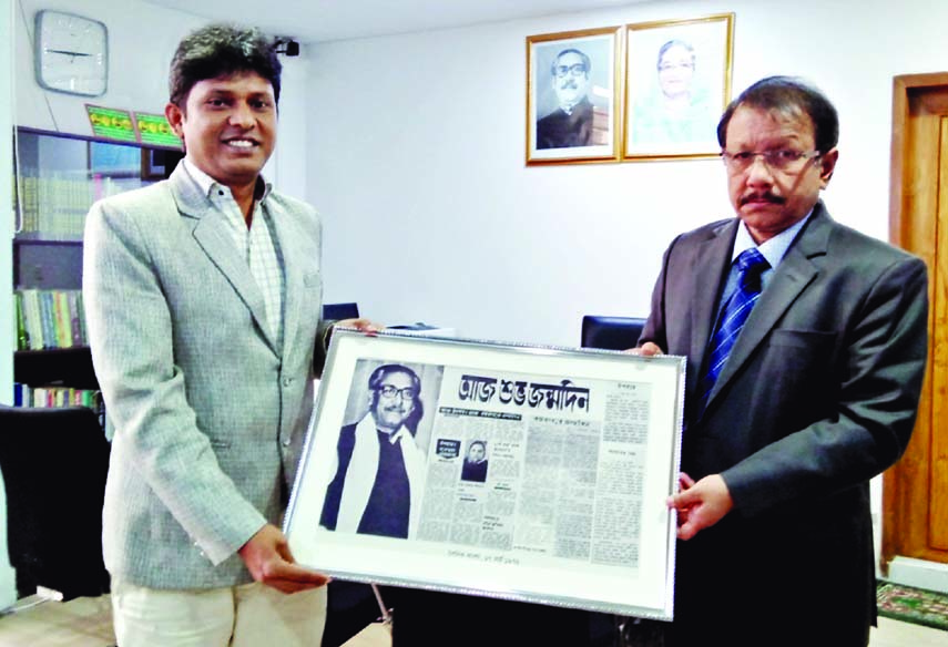 Nazrul Islam Bashir, a researcher and journalist handing over an archival document on the 53rd birth celebration of Bangabandhu on 17th March, 1972 to Dr. Kamal Abdul Naser Chowdhury, Chief Coordinator of Father of the Nation Bangabandhu Sheikh Mujibur Ra