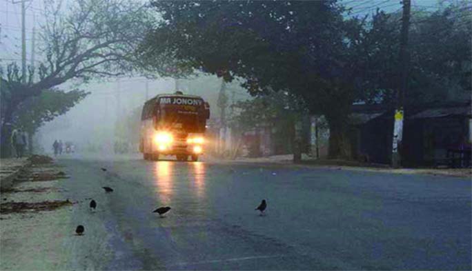 RAJSHAHI: Bus is using headlights at day time in Rajshahi due to dense fog . This picture was taken yesterday.