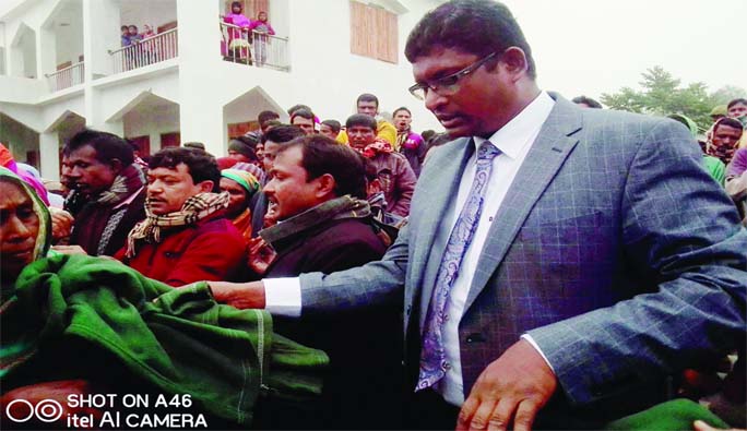 SUNDARGANJ (Gaibandha): Barrister Shameem Haider Patwari MP distributing blankets among the poor people at Sundatganj Upazila on Monday.