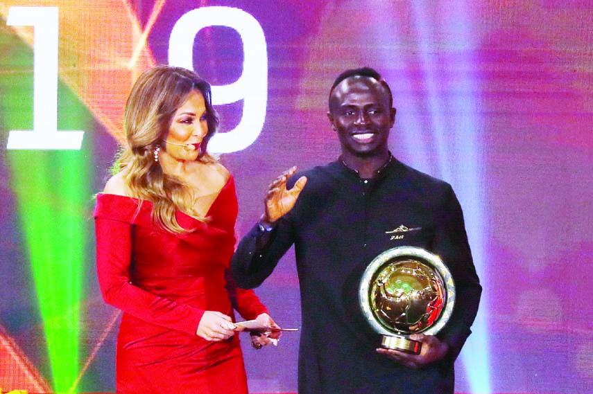 Senegal's Sadio Mane (right) receives the men's player of the year award, Albatros Citadel Sahl Hasheesh, Hurghada, Egypt on Tuesday.