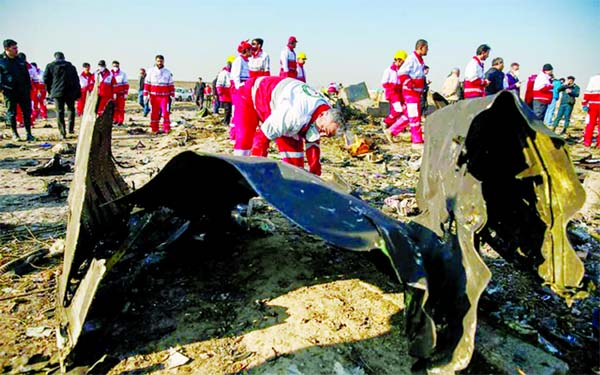 Passengers' belongings are pictured at the site where the Ukraine International Airlines plane crashed after take-off from Iran's Imam Khomeini airport, on the outskirts of Tehran on Wednesday. (News of page-1).