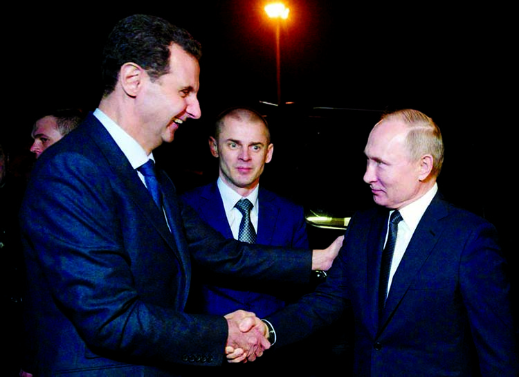 Syrian President Bashar al-Assad (L) shakes hands with Russian President Vladimir Putin (R) in Damascus, Syria. Internet photo