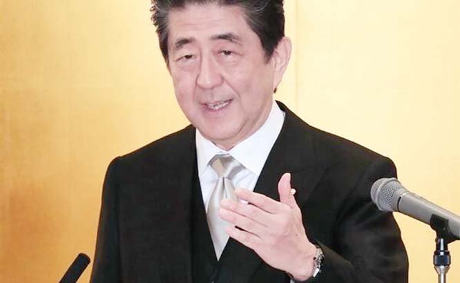 Japanese Prime Minister Shinzo Abe speaking at a televised news conference.