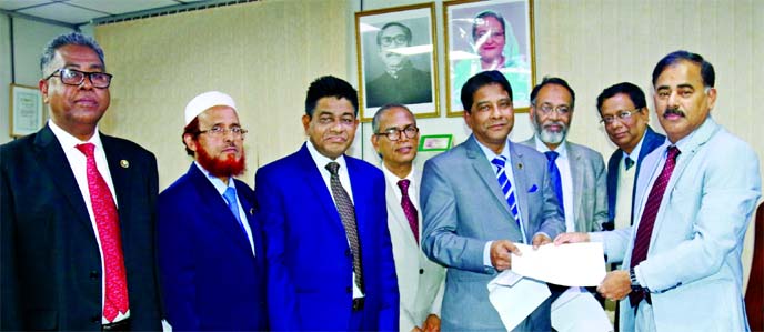 Md Ataur Rahman Prodhan, CEO and Managing Director of Sonali Bank Limited, handing over appointment letters to the newly promoted General Managers at his office in the capital recently. The promoted General Managers are: Md Mujibur Rahman, Muhmmad Nazrul