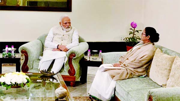 PM Modi meets Mamata Banerjee at the Raj Bhavan in Kolkata on Saturday.