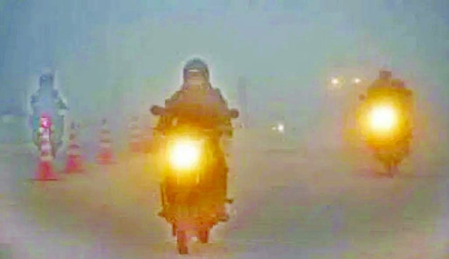 Vehicles with their headlights plied on many streets in city among dense fog on Saturday. This photo was taken from Kakoli area in Banani.