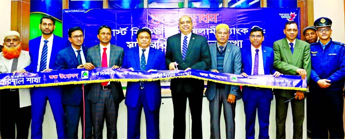 Syed Waseque Md Ali, Managing Director of First Security Islami Bank Limited, inaugurating its relocated branch at new premises at Fallpotri Port Road in Barishal Sadar on Sunday. Abdul Aziz, AMD, Md. Rezaul Islam, Barishal Zonal Head, other senior offici