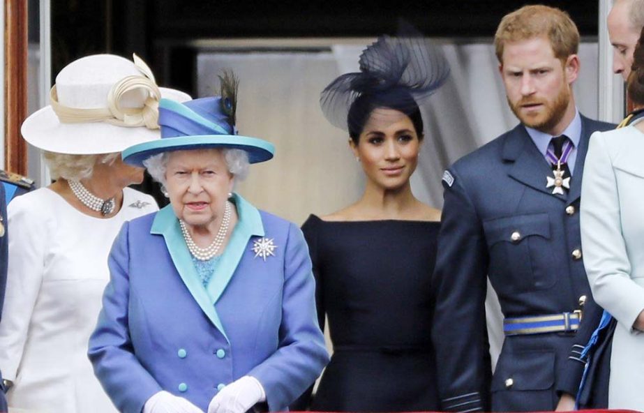 (L-R) Britain's Camilla, Duchess of Cornwall, Britain's Queen Elizabeth II, Britain's Meghan, Duchess of Sussex, Britain's Prince Harry, Duke of Sussex, AND Britain's Prince William, Duke of Cambridge come onto the balcony of Buckingham Palace to wat