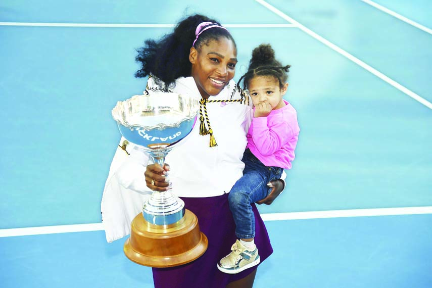 Serena Williams from the United States with daughter Alexis Olympia Ohanian Jr. and the ASB trophy after winning her singles final match against the United States Jessica Pegula at the ASB Classic in Auckland, New Zealand on Sunday.