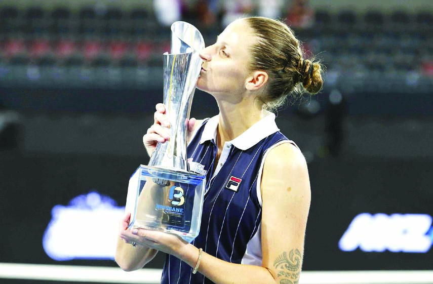 Karolina Pliskova of the Czech Republic poses with the trophy after she won her final match against Madison Keys of the United States 6-4, 4-6, 7-5, at the Brisbane International tennis tournament in Brisbane of Australia on Sunday.