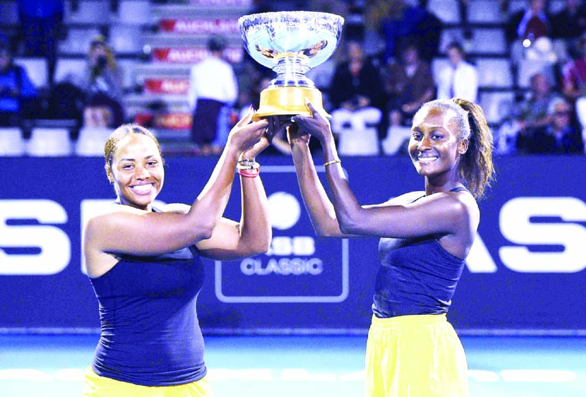 Taylor Townsend (left) from the United States and United Statesâ€™ player Asia Muhammad with the ASB doubles Trophy after winning their finals doubles match against United States Serena Williams and Denmark's Caroline Wozniacki at the ASB Classic in