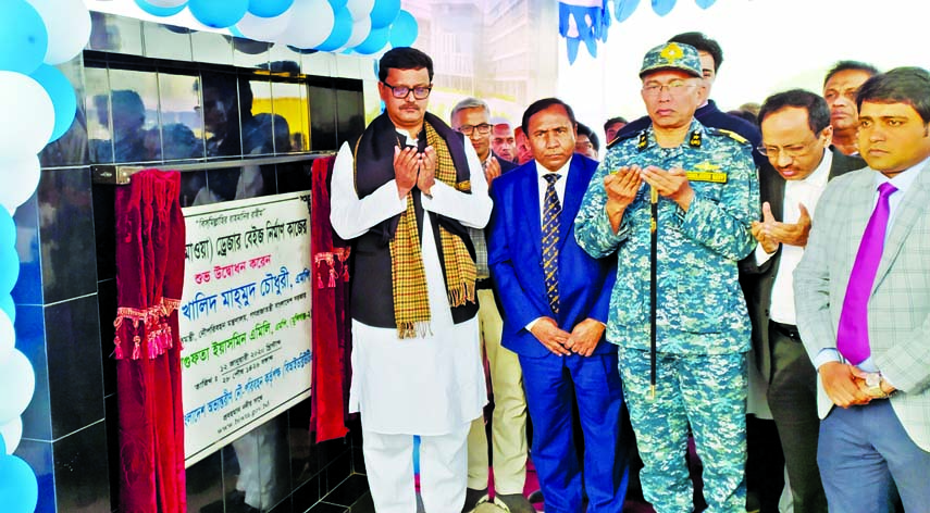 State Minister for Shipping Khalid Mahmud Chowdhury, among others, offering munajat after inaugurating foundation stone of dredger base for digging ten thousand kilometer waterway of BIWTA in Shimulia on Sunday.