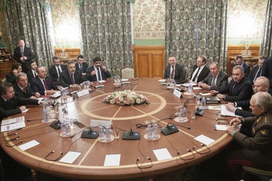 Turkish Foreign Minister Mevlut Cavusoglu, (third left), Turkish Defense Minister Hulusi Akar, (second left), Russian Foreign Minister Sergey Lavrov, (fourth right), and Russian Defense Minister Sergei Shoigu, (third right), attend the talks in Moscow, Ru