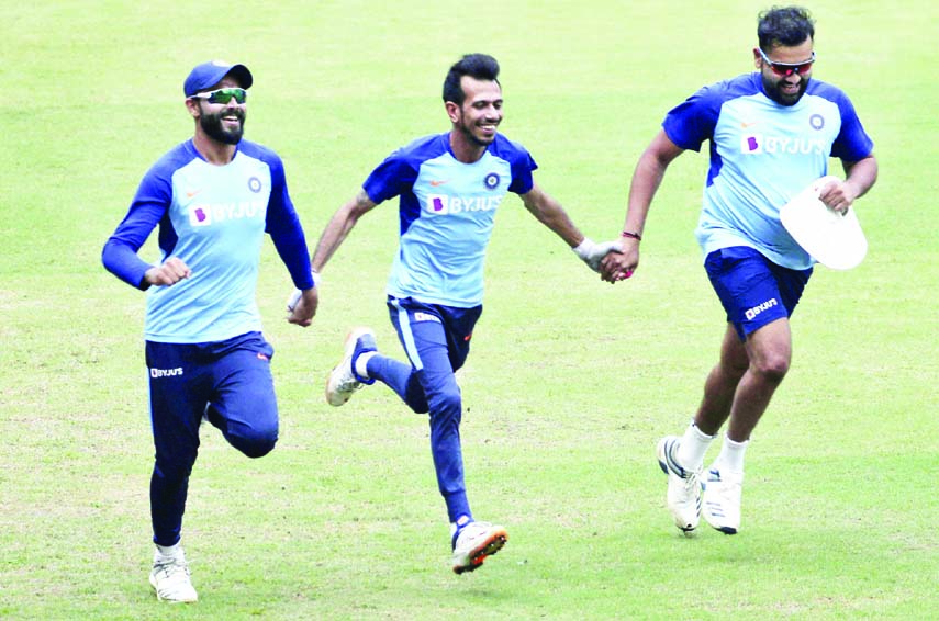 India's Ravindra Jadeja (left) along with Yuzvendra Chahal (center) and Rohit Sharma attend a training session ahead of their first One Day International (ODI) cricket match against Australia, in Mumbai of India on Monday.