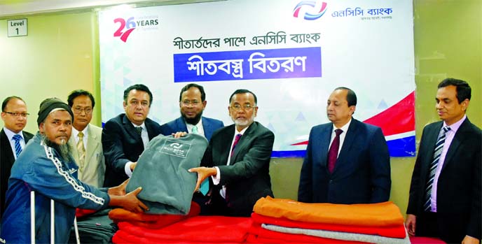 Md. Nurun Newaz Salim, Chairman of NCC Bank Limited, inaugurating blanket distribution programme among the cold stricken people in the city recently. Khairul Alam Chaklader, Director and Risk Management Committee Chairman, Muhammad H. Kafi, Head of Operat