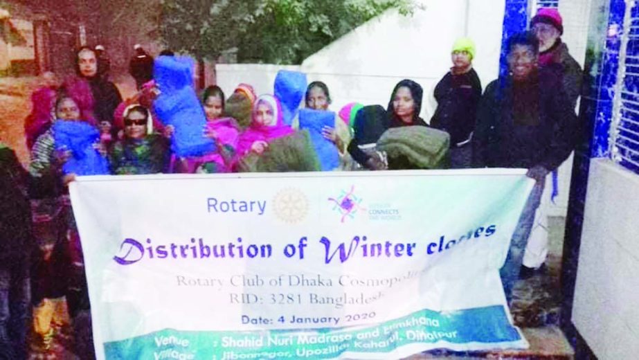 DINAJPUR: Rotary Club of Dhaka Cosmopolitan distributing blankets and other winter clothes among the students of various educational institutes of Kaharol Upazila in Dinajpur recently .