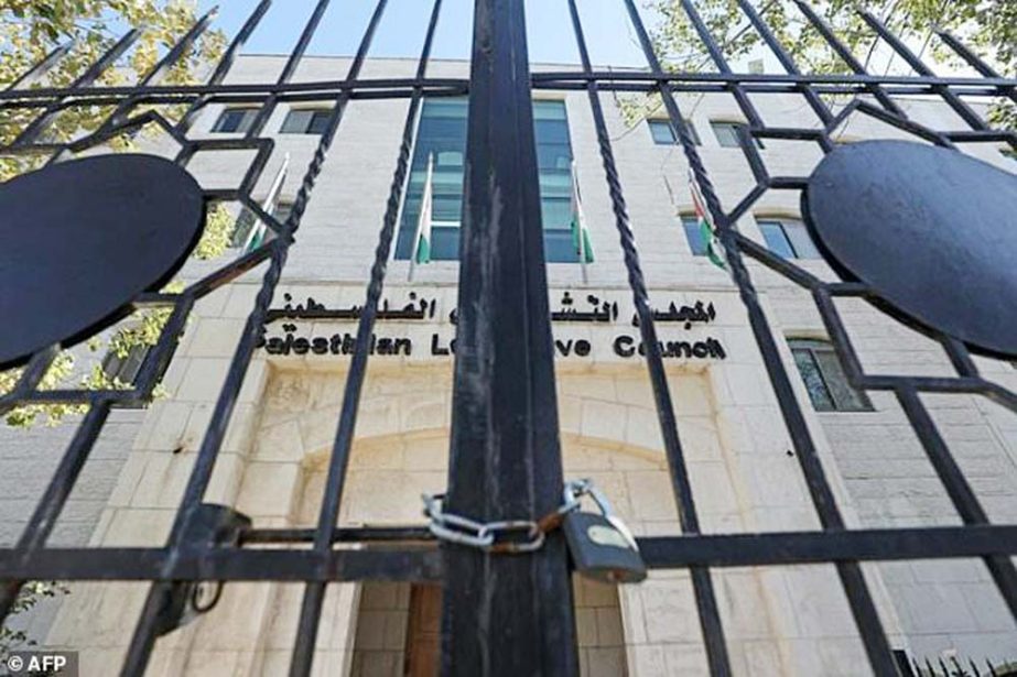 Locked gates at the entrance to the defunct Palestinian parliament in the West Bank city of Ramallah