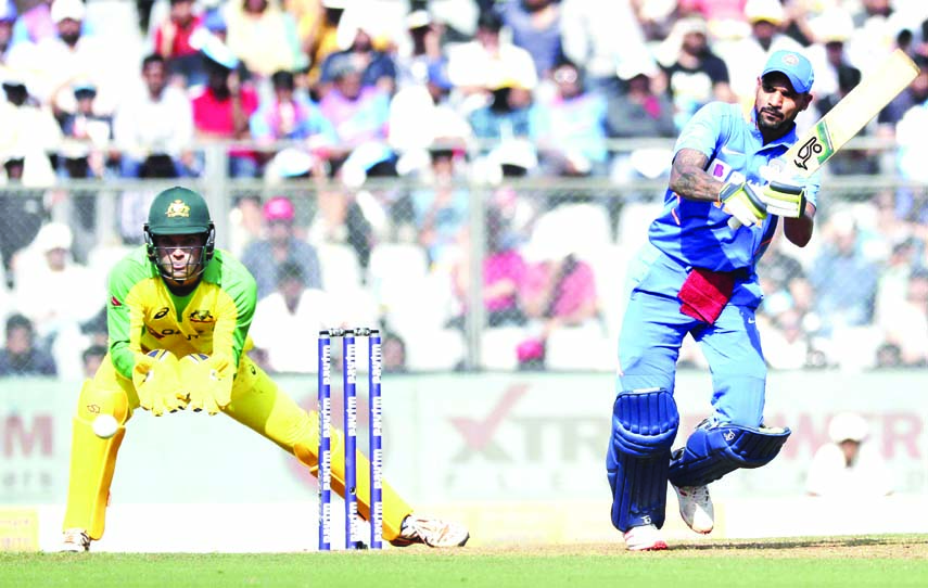 India's Shikhar Dhawan bats during the first one-day international cricket match between India and Australia in Mumbai, India on Tuesday.