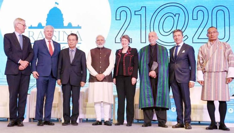 Indian Prime Minister Narendra Modi, fourth left, poses with other leaders during the inaugural session of Raisina Dialogue, a global conference to discuss the most challenging issues facing the world community in New Delhi, India, on Tuesday