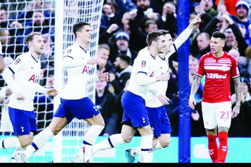 Tottenham's Giovani Lo Celso (second from right) celebrates with teammates after scoring his side's first goal during the English FA Cup third round replay soccer match between Tottenham Hotspur and Middlesbrough FC at the Tottenham Hotspur Stadium in L