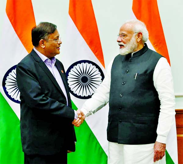 Information Minister Dr Hasan Mahmud and Indian Prime Minister Narendra Modi shaking hands as they met at the latter's office in New Delhi on Wednesday.