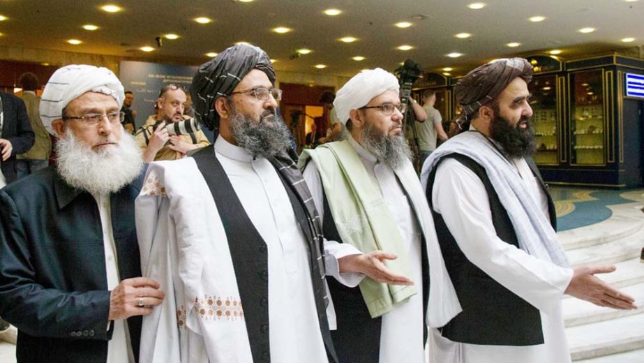 Mullah Abdul Ghani Baradar, the Taliban group's top political leader, second left, arrives with other members of the Taliban delegation for talks in Moscow, Russia. U.S. peace envoy Zalmay Khalilzad held on Saturday the first official talks with Afghanis