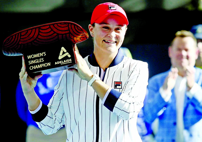 Australian Ashleigh Barty poses with the trophy after winning at the Adelaide International tennis final match in Adelaide on Saturday.