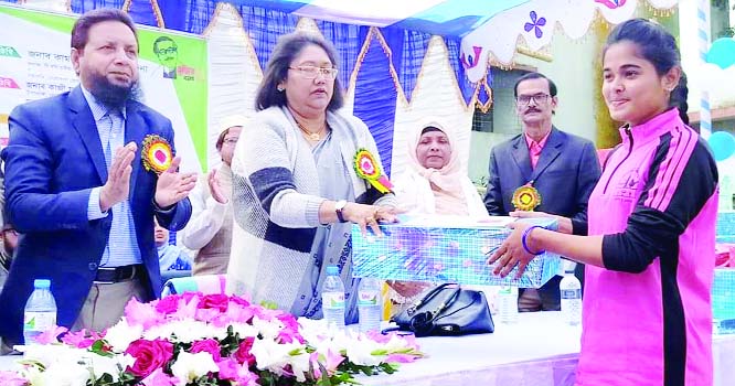 NETRAKONA: Renowned social worker Kamrunnesa Ashraf Dina , wife of State Minister for Fisheries and Live Stock Ashraf Ali Khan Khasru MP distributing prizes among the winners of annual sports competition of Netrakona Government Womenâ€™s College a
