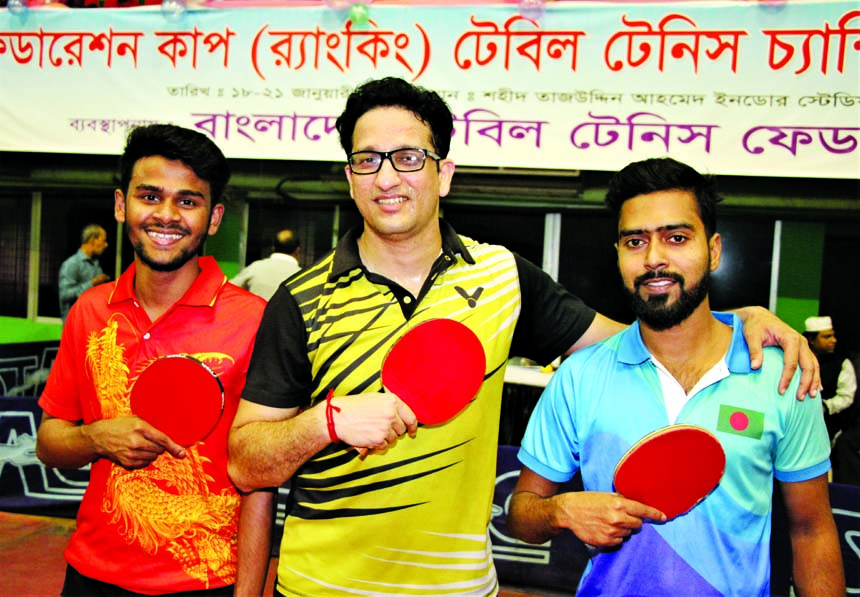 Players of Sheikh Russel KC, the champions in the men's team event of the Federation Cup (Ranking) Table Tennis Tournament pose for a photo session at the Shaheed Tajuddin Ahmed Indoor Stadium in Paltan Ground on Sunday. Sheikh Russel KC defeated Banglad