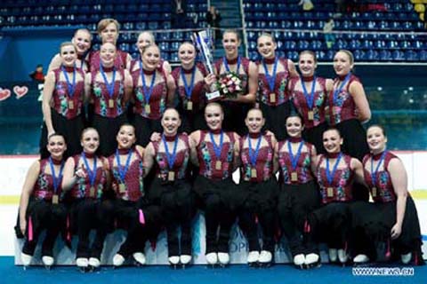 Members of Group Skyliners of the United States pose on the podium after winning the 16th Zagreb Snowflakes Trophy synchronized skating competition in Zagreb, Croatia on Saturday.