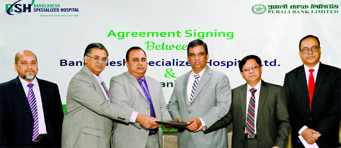 Md. Abdul Halim Chowdhury, CEO of Pubali Bank Limited and Al Emran Chowdhury, CEO of Bangladesh Specialized Hospital Limited, exchanging document after signing an agreement at the banks head office in the city on Monday. Under the deal, all card holders a