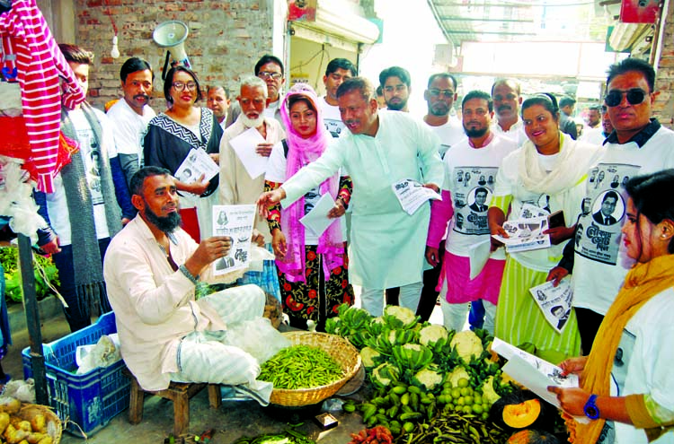Election campaign for DSCC mayoral candidate Barrister Sheikh Fazle Nur Taposh in the city's Shanir Akhra, Shyampur and Kadamtali areas on Monday.