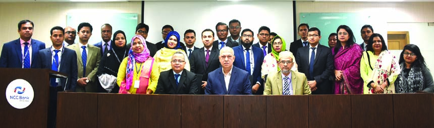 Khondoker Nayeemul Kabir, DMD of NCC Bank Limited, poses for photograph with the participants of a day-long workshop on "Prevention of Money Laundering & Combating the Financing of Terrorism" at the bank's training institute in the city recently. Md. A