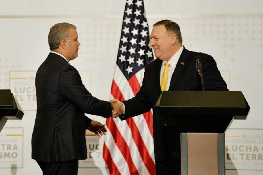 US Secretary of State Mike Pompeo (right) shakes hands with Colombia President Ivan Duque as the two meet in Bogota to discuss the humanitarian crisis in Venezuela.