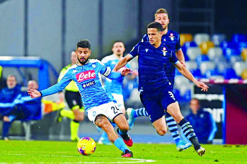 Napoli's Lorenzo Insigne (left) competes for the ball with Luiz Felipe of Lazio during the Italian Cup soccer match between Napoli and Lazio at Milan in Italy on Tuesday.
