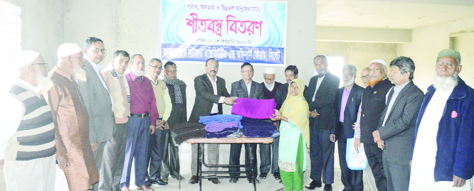 SYLHET: Janata Bank Retired Executive and Officers' Forum, Sylhet distributing winter clothes among the cold affected people in Subidbazar area of Sylhet on Monday.