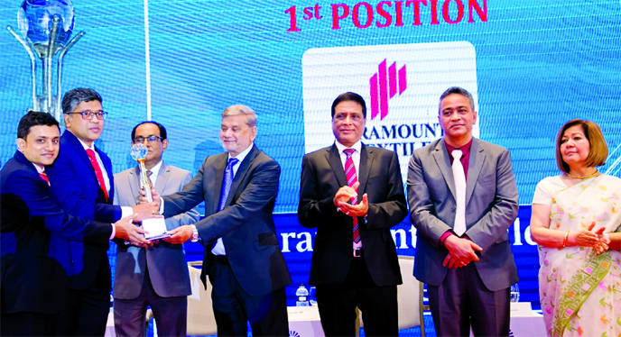 Mohammad Jahidul Abedin, Chief Financial Officer of Paramount Textile Limited, receiving the "First Position" in "ICMAB Best Corporate Award-2018" in Textile Manufacturing Category from Planning Minister M A Mannan, M.P at Hotel Inter Continental in t
