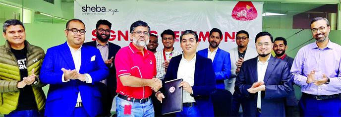 Shihab Ahmed, Chief Commercial Officer of Robi and Md. Jahir Uddin, Chief Financial Officer sheba.xyz, exchanging document after signing an agreement on at Robi's head office in the city recently. Under the deal, sheba.xyz will be able to use Robi's 150