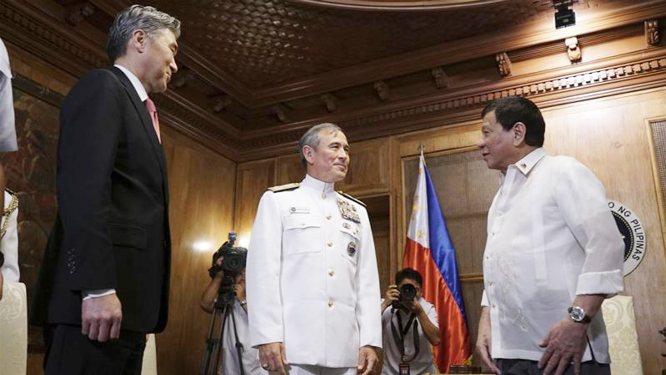 Duterte (right) receives US Pacific Command chief Adm Harry Harris Jr, (centre), and US Ambassador to the Philippines Sung Kim during a courtesy call at the presidential palace in Manila.