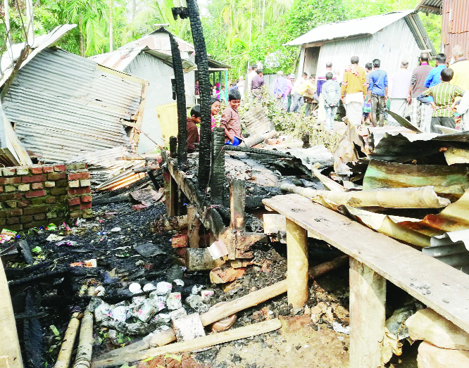 BETAGI (Barguna): A devastating fire gutted three shops at Jhopkhali Bazar in Betagi Upazila on Friday .
