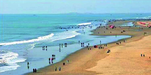 Visitors enjoying an afternoon on Parki Beach in Chattogram's Anwara Upazila.