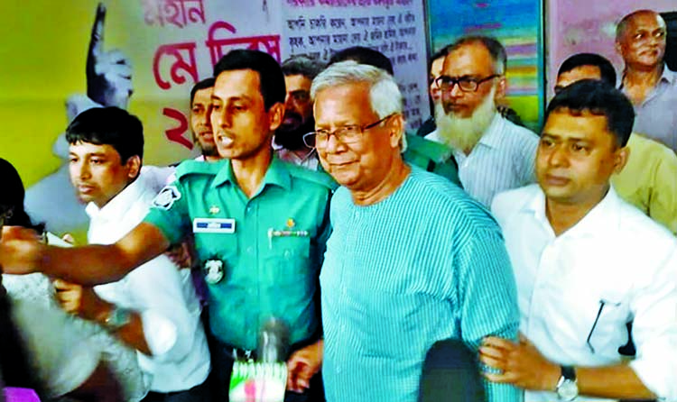 Nobel laureate Dr Muhammad Yunus coming out from the 3rd Labour Court in Dhaka after getting bail over the firing of three employees by Grameen Communications yesterday.